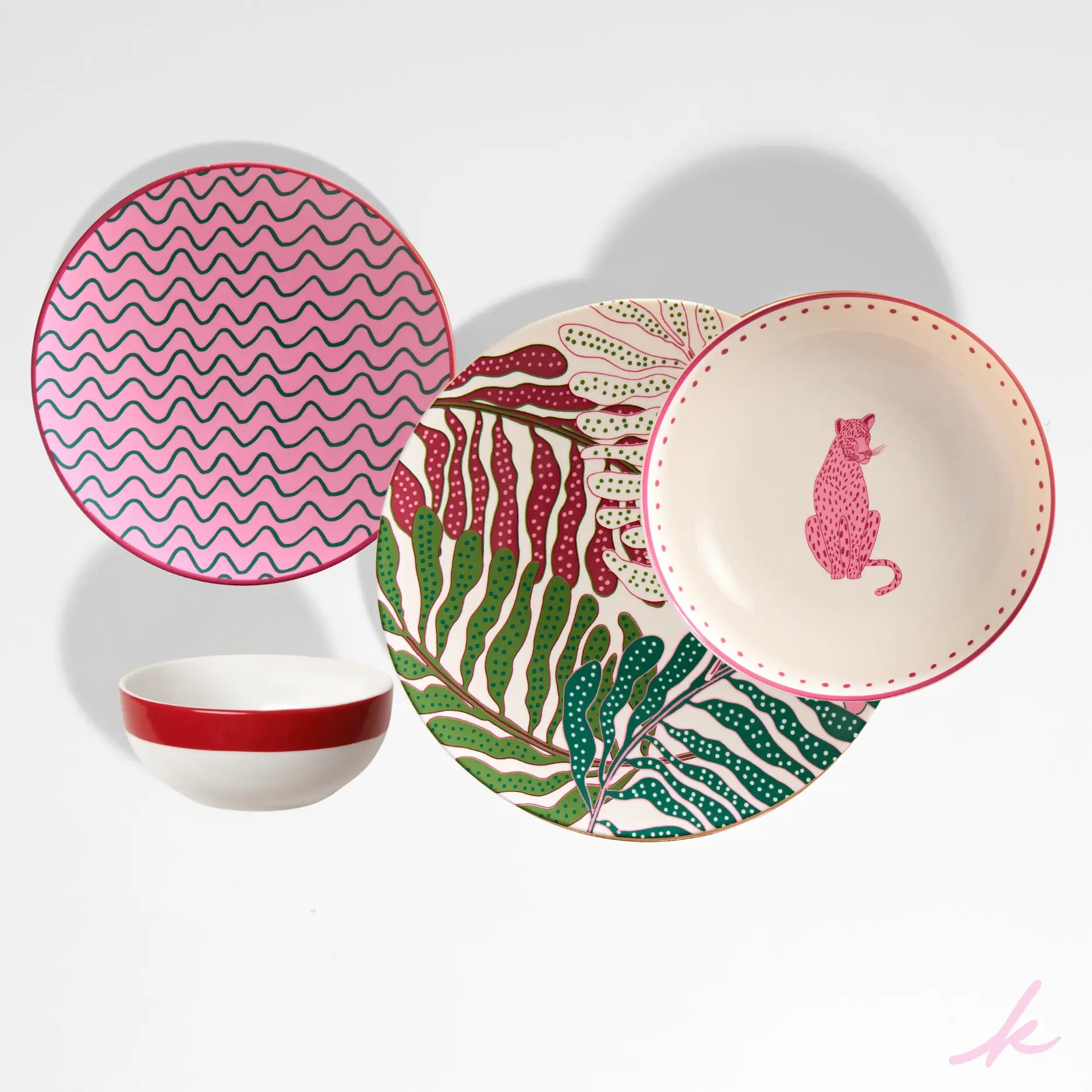 Complete Leopard Set displayed together, featuring an array of beautifully designed plates, each with unique animal and botanical motifs, including leopards, leaves, and intricate patterns on fine porcelain