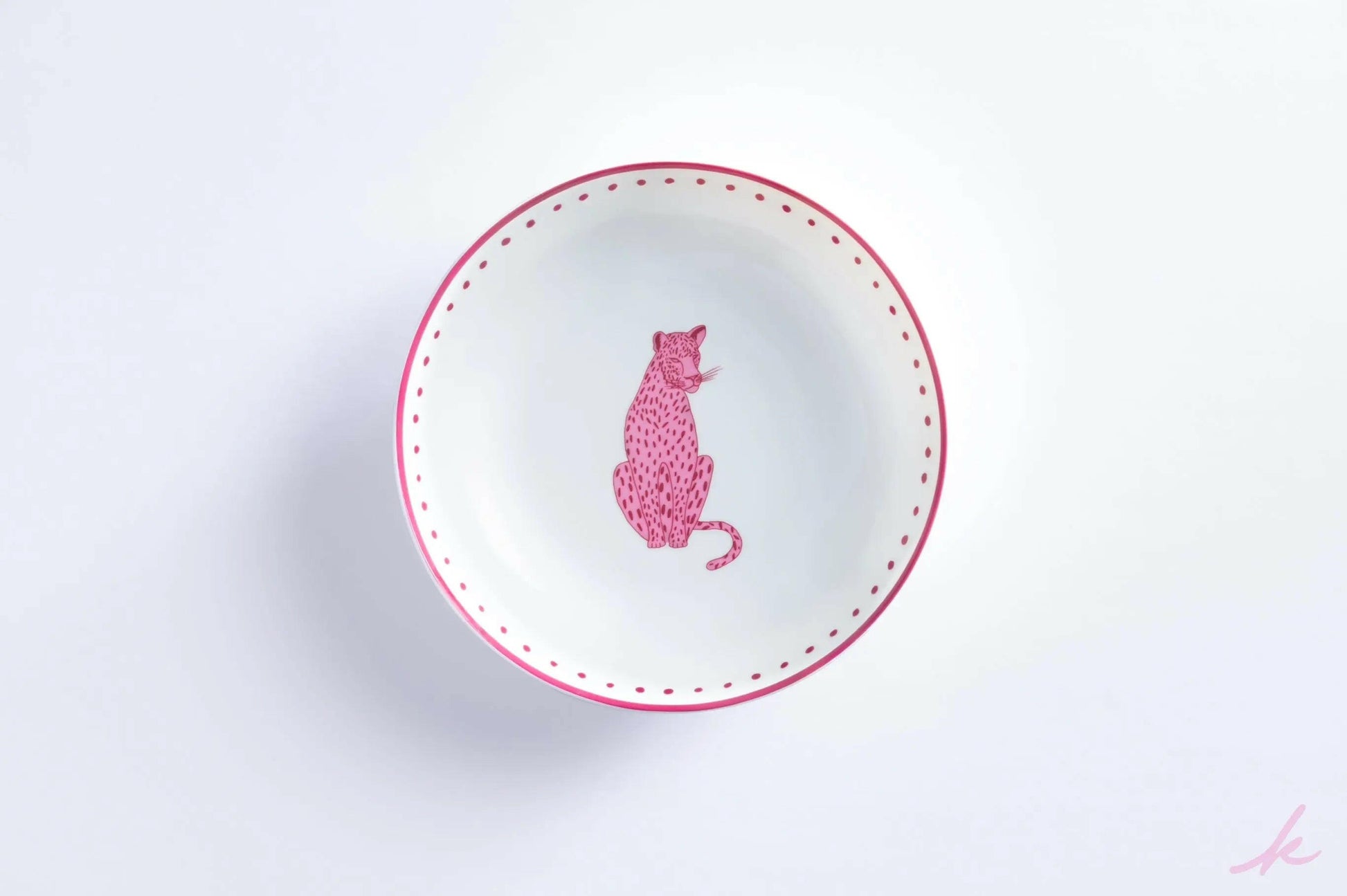 Spaghetti plate featuring a playful pink leopard design, set against a subtle background of delicate botanical elements, perfect for adding a touch of wild elegance to your dining experience.