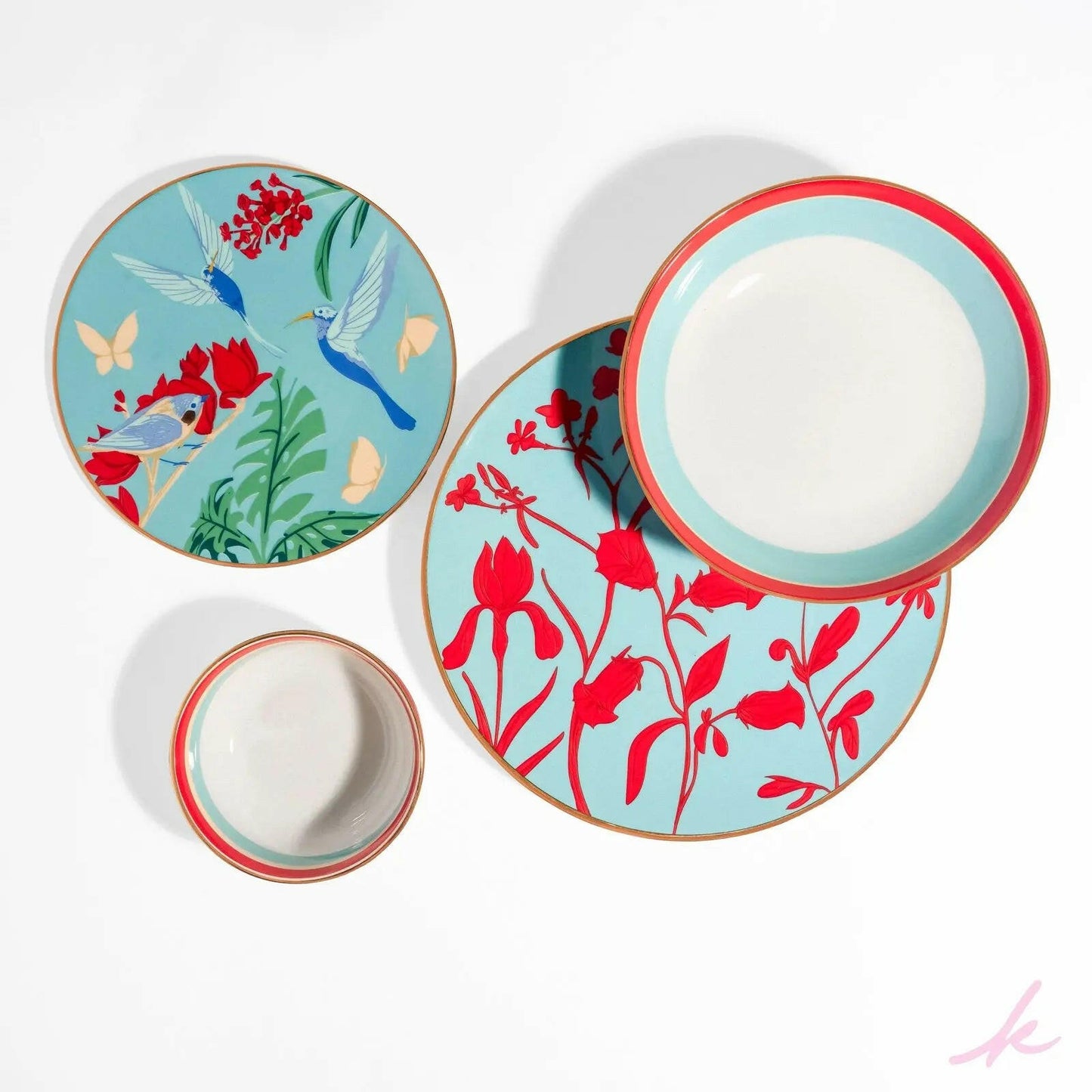 The Rebel Roots Set displayed together, featuring vibrant blue and red designs, with hummingbird motifs on the dessert plates, bringing creativity and boldness to your table